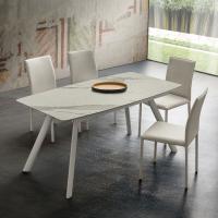 Jeremy extending table also available with barrel-shaped top in Laminam stone
