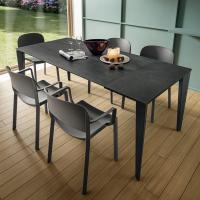 Modesty extending rectangular dining table with Laminam Charcoal Savoy Stone top