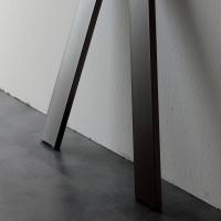 Detail of the base of Akin console table available in various painted metal finishes