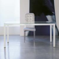 Self everyday custom table with an extra-clear glass top and a glossy white painted steel structure