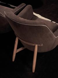 Close-up of the Eve armchair with hand-turned wooden base