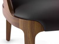 Details of the solid Canaletto Walnut wood structure of the armchair Velis
