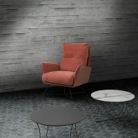 Maude armchair with high back characterised by a modern steel base