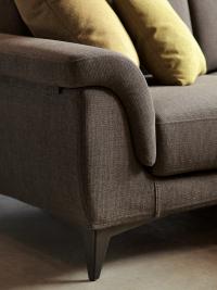 Detail of the shaped armrest with cosy shapes, fixed upholstered cushion