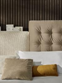 Detail of the two headboards in different height, one Soft with smooth cover and one Button Tufted