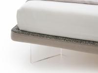 Detail of the extra slim h.5 cm bed-frame, upholstered and covered with two fabrics