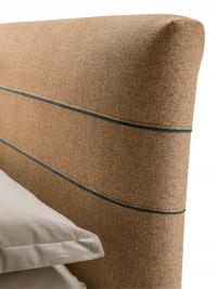 Close-up of the headboard enhanced with stitching details
