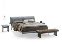 Ametista bench with upholstered cushion, placed at the bottom of the bed