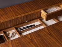 Detail of the storage compartment with genuine leather-covered bottom: beige colour with natural walnut wood, white colour with natural grey walnut wood