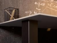 Detail of the joining point between glass top and leg, in this case made out of metal. The Musa desk can be customised with legs in different shapes and materials.