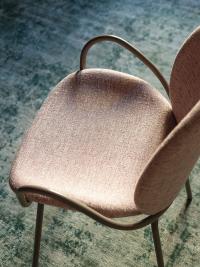 Athena upholstered chair with thin legs and a comfortable, entirely upholstered seat