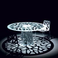 Domino chair in pierced metal plate matched with the round Domino table