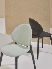 Jewel chairs upholstered and covered in fabric, one with an Anthracite Grey RAL 7016  and one Black RAL 9017 stained ash frame