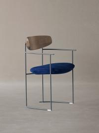 Keel upholstered designer chair with armrests