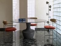 Design chair with upholstered Keel seat combined with Anfora table