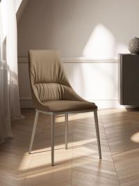 Lora upholstered chair with stitching and metal legs