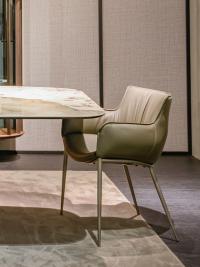 Rhonda chair by Cattelan with metal legs and wrap-around armrests