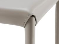 Detail of the connection between the seat and legs of the Denali stool upholstered in leather