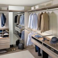 Joyce Pacific walk-in closet equipped with glass shelves with metal frame and trouser rack with glass drawer