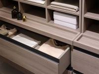 Set of drawers with pocket emptier/ coin tray and shirt caddies resting on top