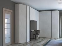 Pacific wardrobe with rounded-off corner - doors and sides in ‘Nature’ lotus melamine, top-to-bottom recess grip opening in ‘Rope Grey’ matt lacquer