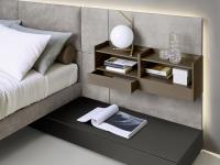 California upholstered bed with wall panelling matched with shelves with drawers