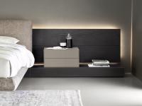 Close up of the wood-veneer wall panelling with the California upholstered bed 