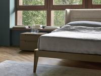 Close up of the wooden bed frame with matching legs