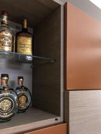 One compartment of the wall unit can be used as a bar cabinet for bottles, glasses and wine glasses. Ash oak finish not available