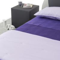Detail of the flat sheet in colour 47 purple and pillow cases, duvet cover in colour 45 lilac