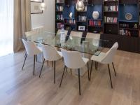 Dining area with fixed rectangular table and eight chairs