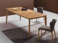 Nelia modern wooden table with carpentry workmanship on the top
