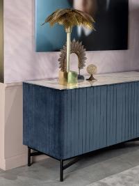 Details of the Extrò sideboard, upholstered in velvet and with marble-effect porcelain stoneware top.