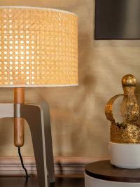 Detail of the Vienna straw lampshade and solid canaletto walnut lamp holder in the table version