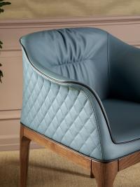 Mivida tub armchair with wooden base - a view of the diamond-quilted backrest