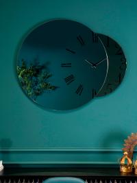 Fusion clock mirror, the smaller surface is available in a bronze or smoked finish.
