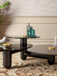 Cosmo coffee table with three tops with visible prominent solid black ashwood frame. 