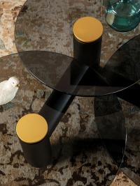 Cosmo coffee table with three tops button detail in matte gold lacquered metal which contrasts with the tops and frame.
