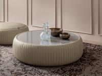 Plissè coffee table upholstered in faux-leather, with a lacquered or frosted glass top