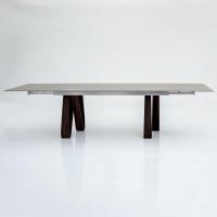 Wooden table with modern design Butterfly in the extending model with glass top and aluminium track