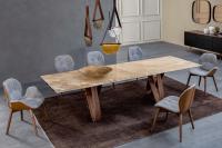 Butterfly extending table with onyx amber porcelain stoneware top