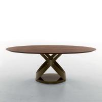 Oval table with canaletto walnut top, stone bronze lacquered metal frame and polished Emperador bronze marble base