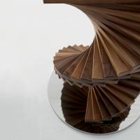 Detail of the spiral structure made of solid wood walnut Canaletto slats 