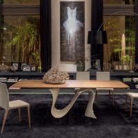 Wave table with central sinuous base in glossy beige Baydur and top in canaletto walnut wood