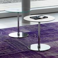 Alias is a contract end table in a round shape with chrome metal base. Here with white laminate HPL top and clear glass top