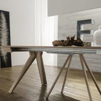 Strange extendable console table  - detail of the intermediate support which imitates the design of the main legs
