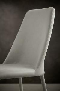 Upholstered chair with matching stitching