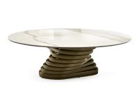 Runder Couchtisch mit Basis im gedrechselten Design Vortex vor dem Sofa positioniert mit Tischplatte in Marmor Carrara und Struktur in Metall gestrichen Bronzo