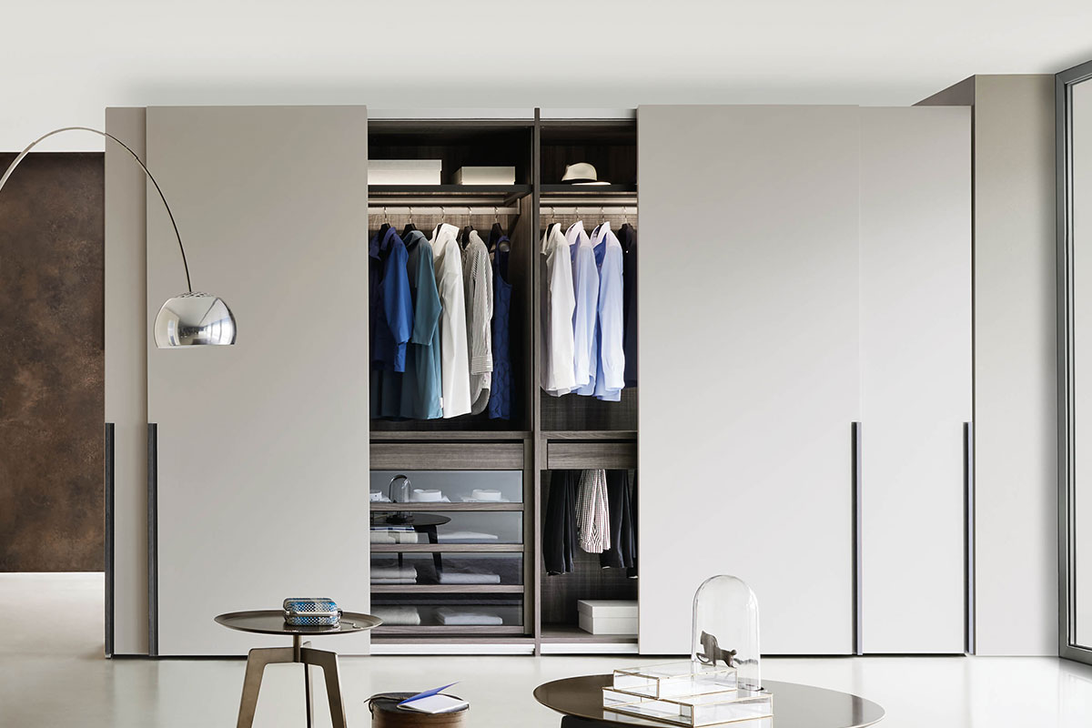 White wardrobe with 4 sliding doors and wooden internal structure