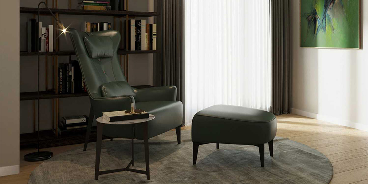 Angolo lettura con poltrona, pouf, tavolino e libreria